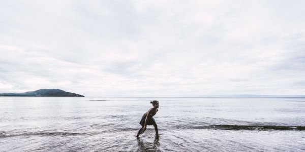 Woman on beach by Parth Upadhyay