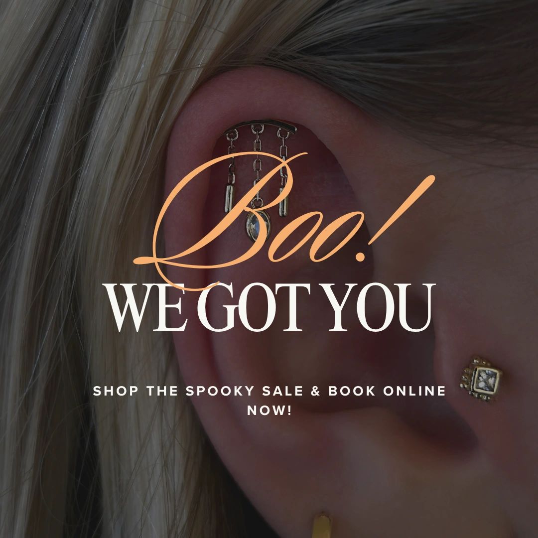 Close-up of a pierced ear with text about a spooky sale.