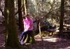 Diane sitting on her stump at Mt Field National Park