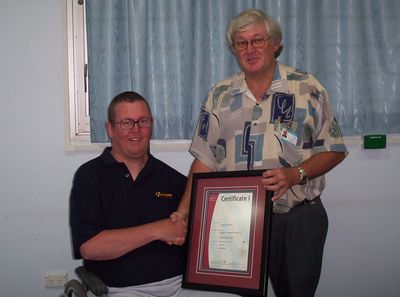 Head  Tutor - Noel, presenting Certificate.