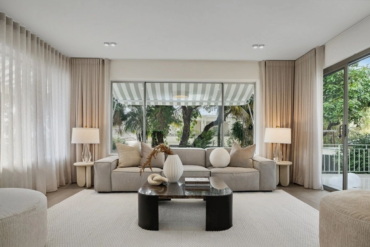 living room with sheer curtains and beautifully designed
