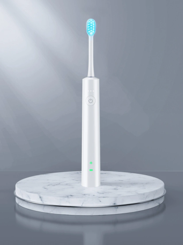 White electric toothbrush with blue bristles on marble pedestal.