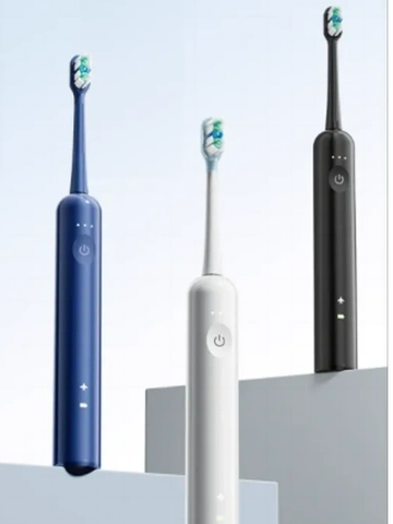 Three electric toothbrushes in blue, white, and black.