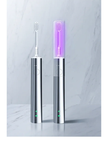 Two sleek electric toothbrushes on a marble surface.