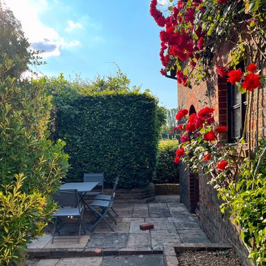 Rose garden and outdoor terrace at Hope Cottage