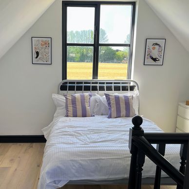 Master bedroom with clean lines , Egyptian cotton linen at Hope Cottage