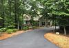 Nothing prettier than a luxurious black ribbon leading to a mountain estate home!