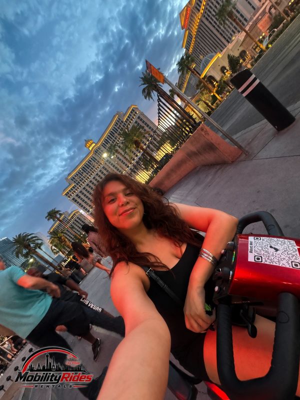 Satisfied rider exploring the las vegas strip with her mobility equipment rental