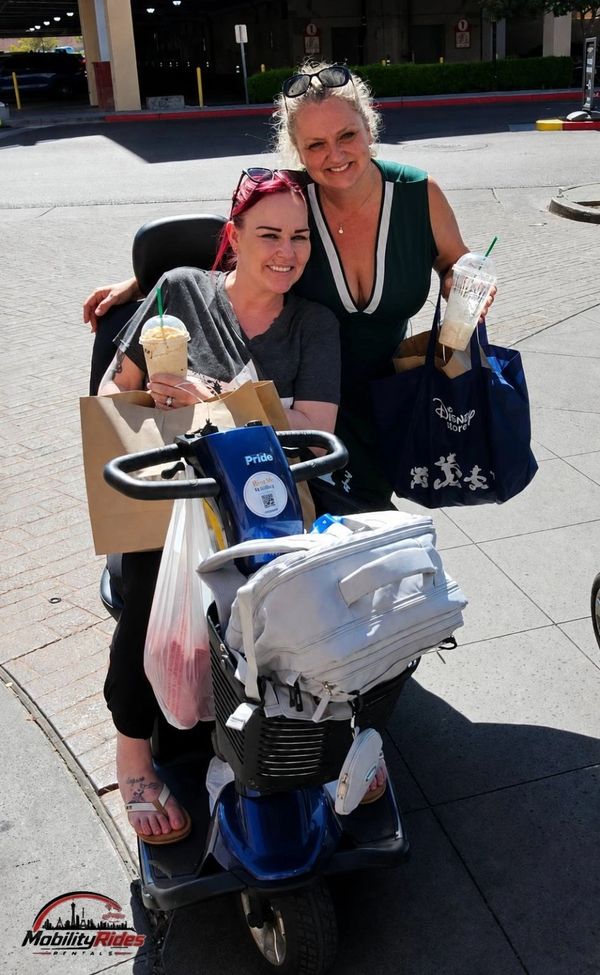 Customers in las vegas receiving their cheap mobility scooter rentals