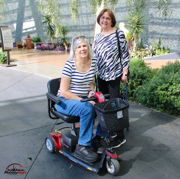 Happy family during their vacation stay in las vegas with their comfortable electric scooter