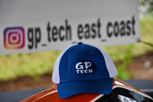 A GP Tech ball cap sat atop the GP Tech display KTM 1190R