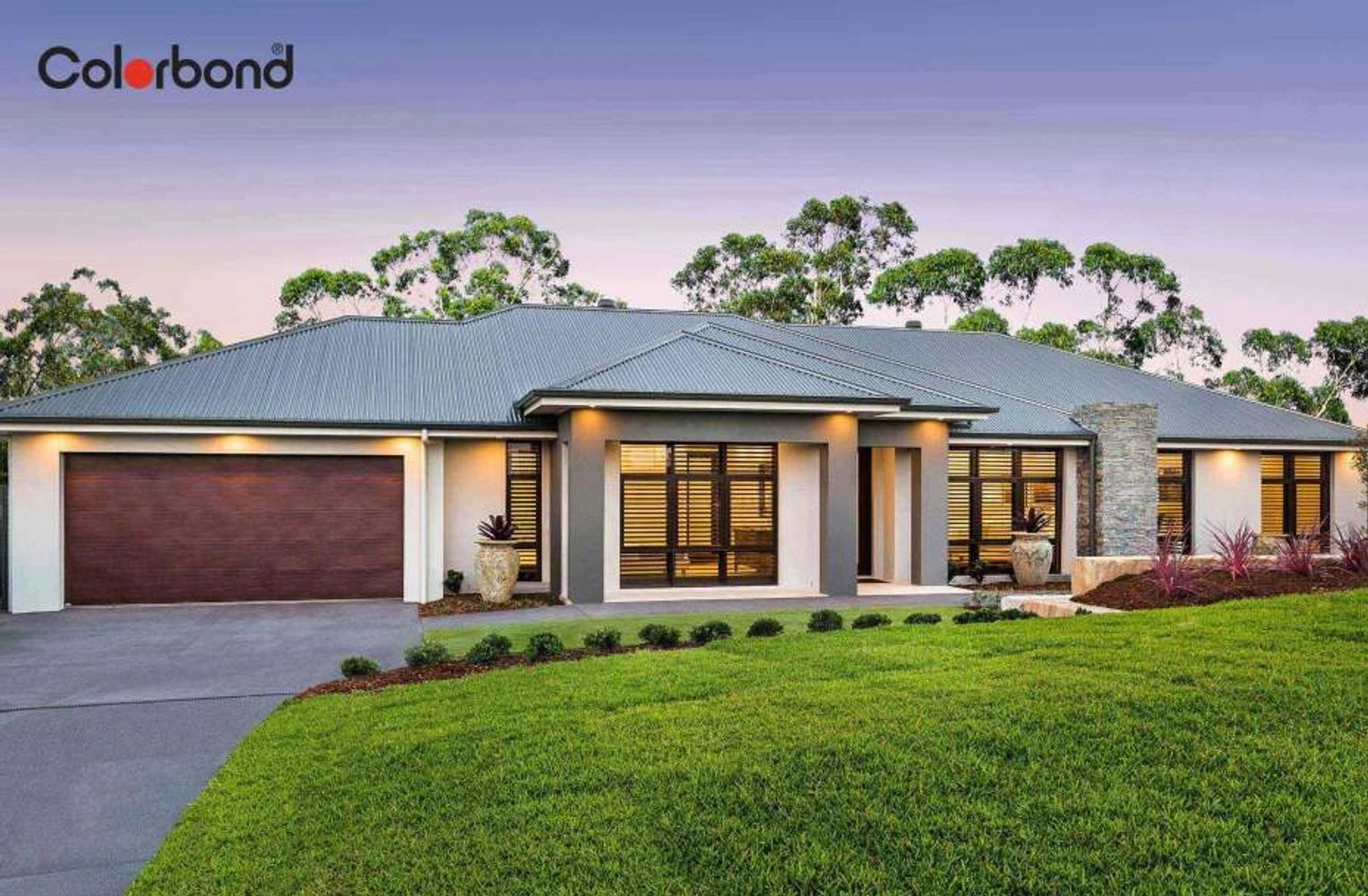 Modern single-story house with a Colorbond roof and well-kept lawn.