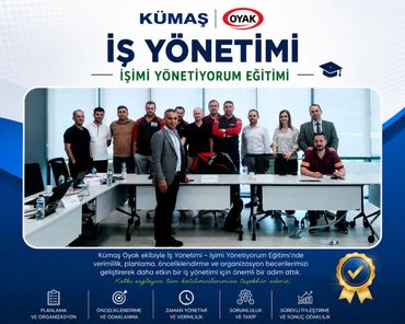 Group photo of participants and trainers at a business management training event.