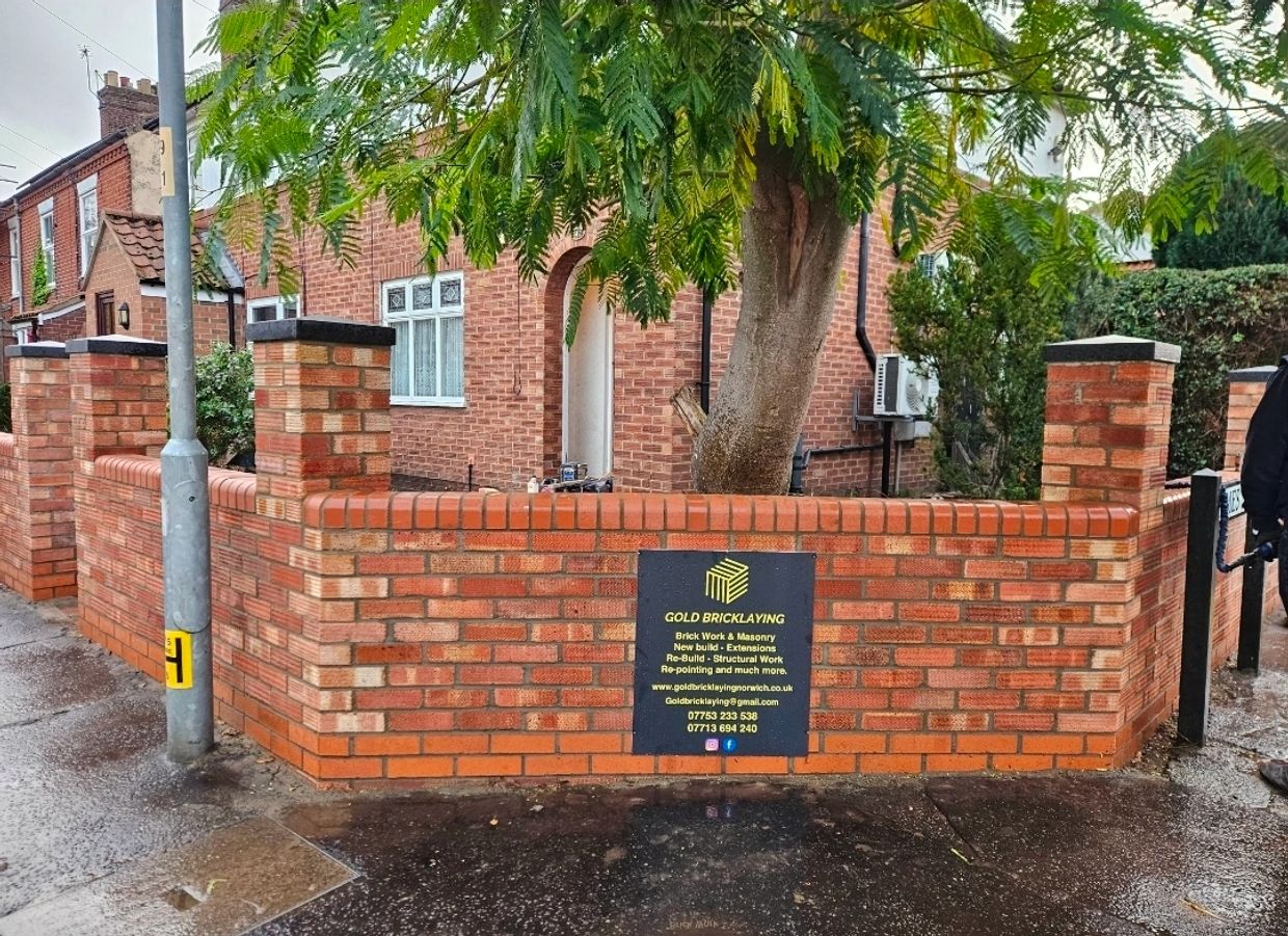 Traditional brick front boundary wall construction in Norwich.