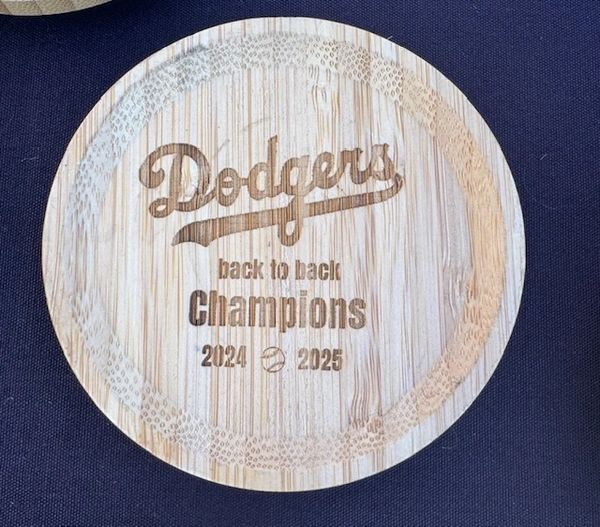 Wooden plaque celebrating Dodgers as back to back champions 2024 and 2025.