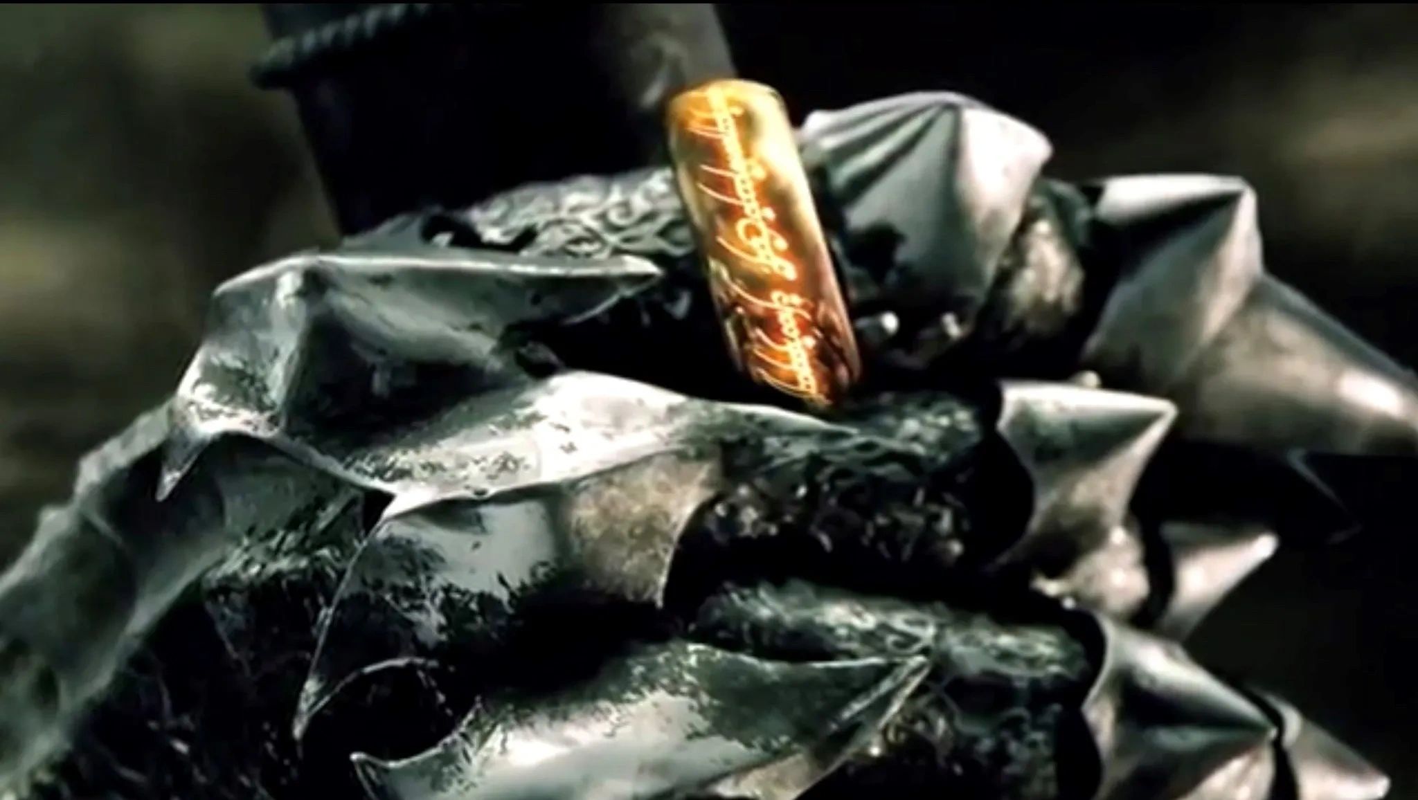 The Ring of Power on Sauron's right hand while holding the Shadow Mace.