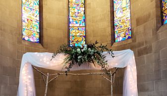 Alter of Fairchild Chapel at Oberlin College with Chuppa of birch branches draped in white fabric