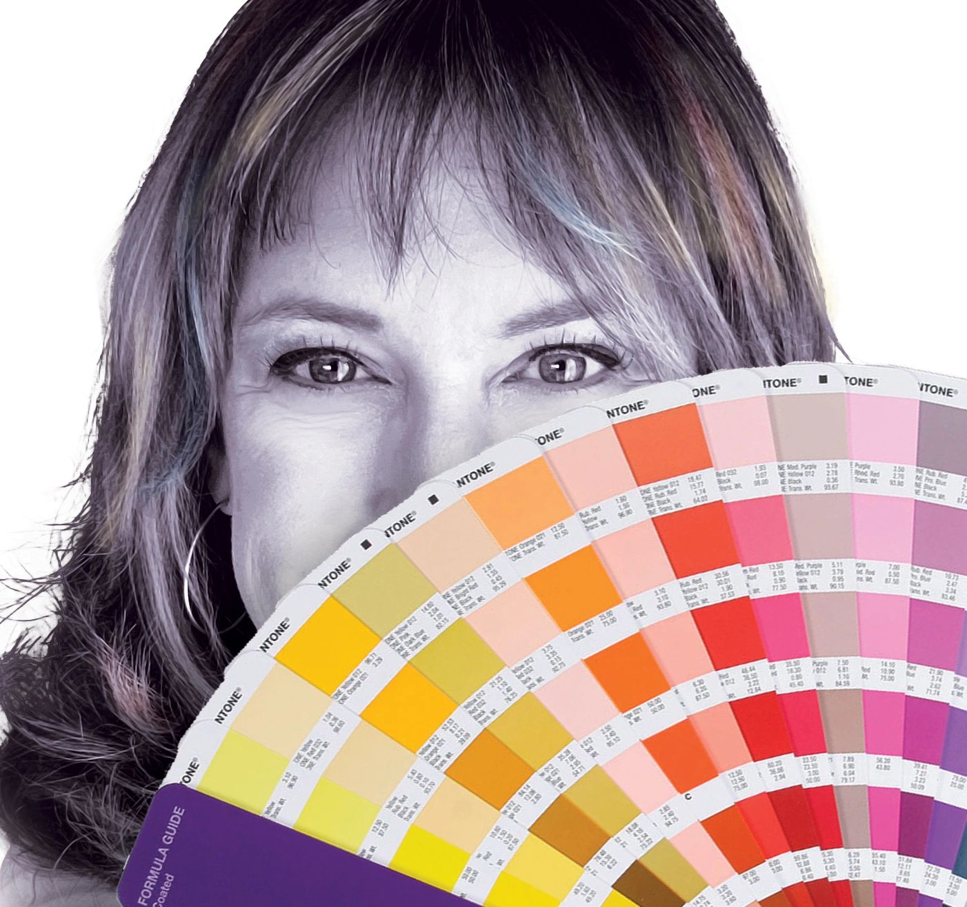 Woman holding a colorful fan of paint swatches.
