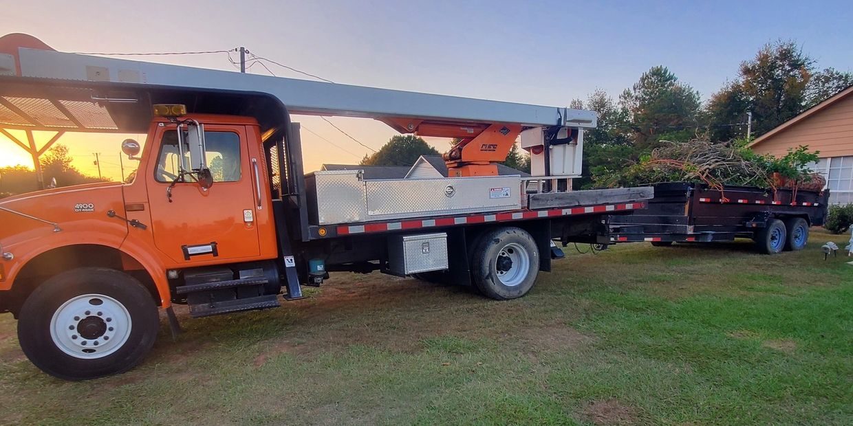 Johnson's Tree Service bucket truck and trailer.