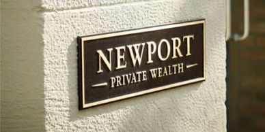 Sign reading 'Newport Private Wealth'.