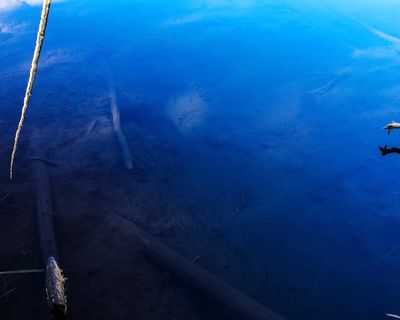 Clear water reflecting the sky above.