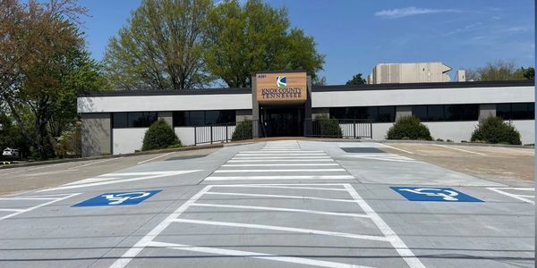 commercial concrete ada ramp, sidewalk, curb and parking lot for the Knoxville county clerk's office