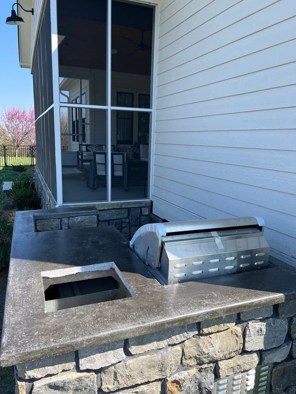 outdoor kitchen with concrete countertop