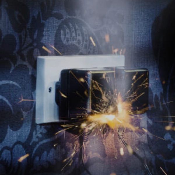 Electrical plug sparking inside an outlet.