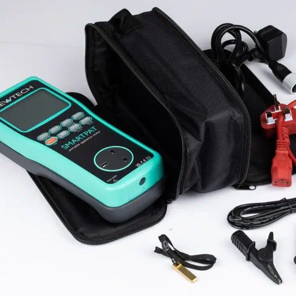 Electrical testing device with accessories and carrying case.