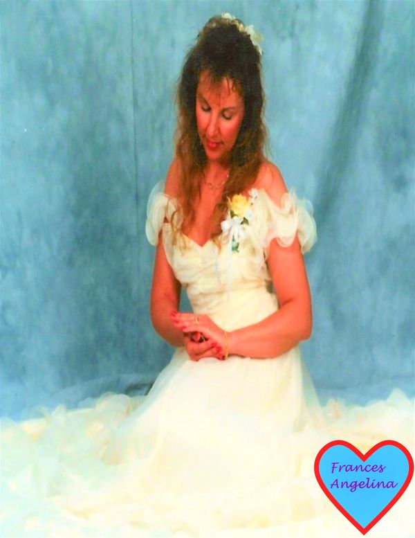 Woman sitting down in a wedding dress
