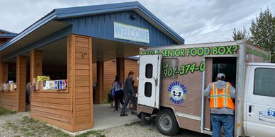 Food box donation van unloading donations at the church
