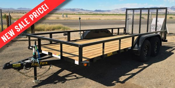 Utility trailer with wooden bed and metal frame, advertised with a new sale price.