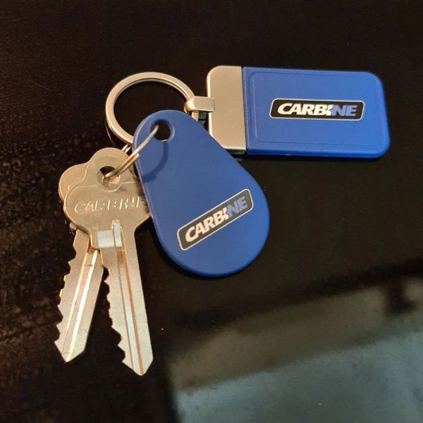 keys on a blue key tag on a table
