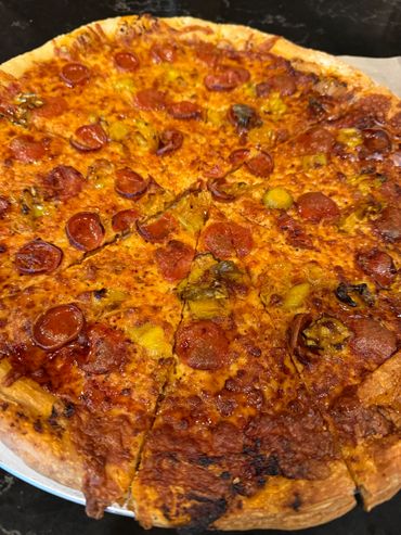 Pepperoni pizza with a crispy crust and melted cheese.