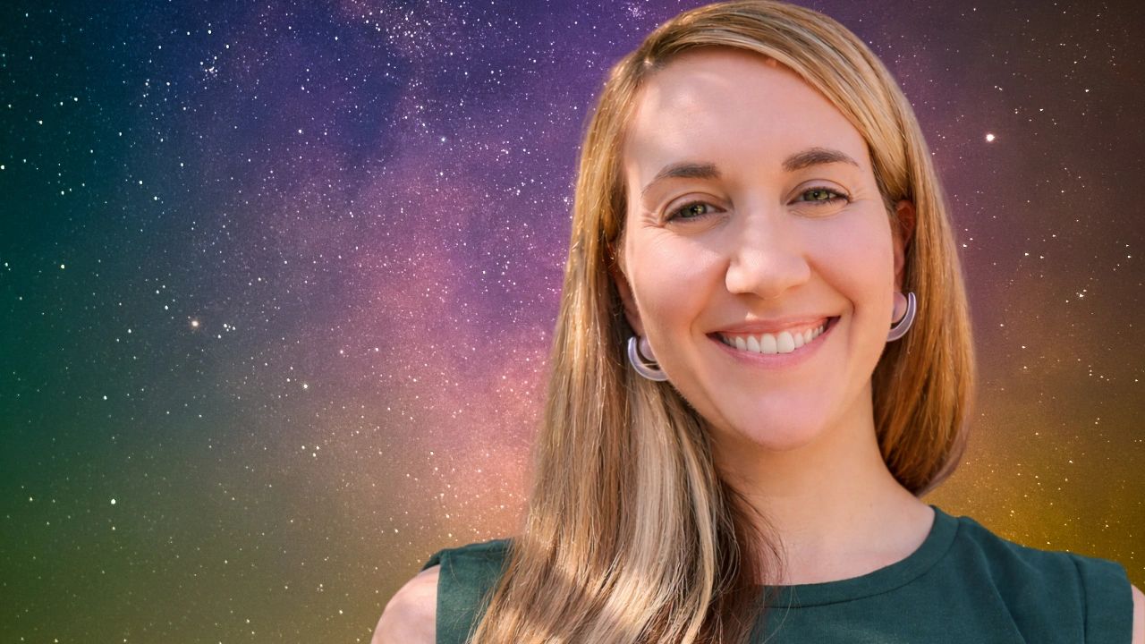 Smiling woman with blonde hair against a vibrant starry night sky.