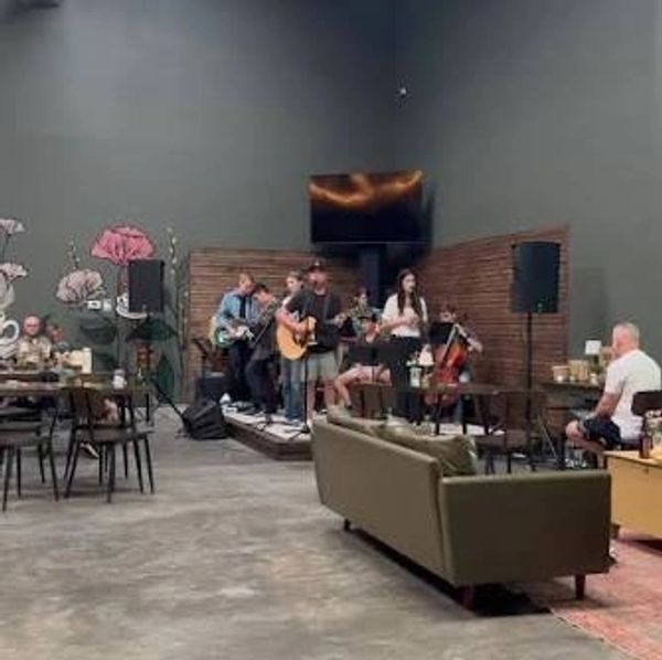 Band playing music in a cozy café.