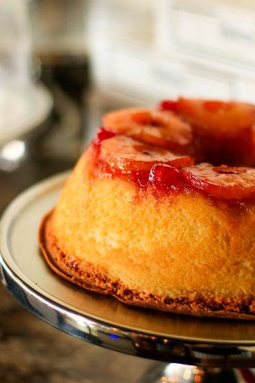 Pineapple upside-down cake on a stand