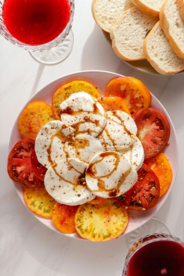 Heirloom tomato and mozzarella salad with balsamic glaze.