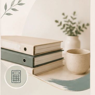 Stack of binders and a ceramic cup on a painted wooden surface with a plant in the background.