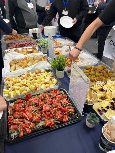 A buffet table with various appetizers and snacks at an event.