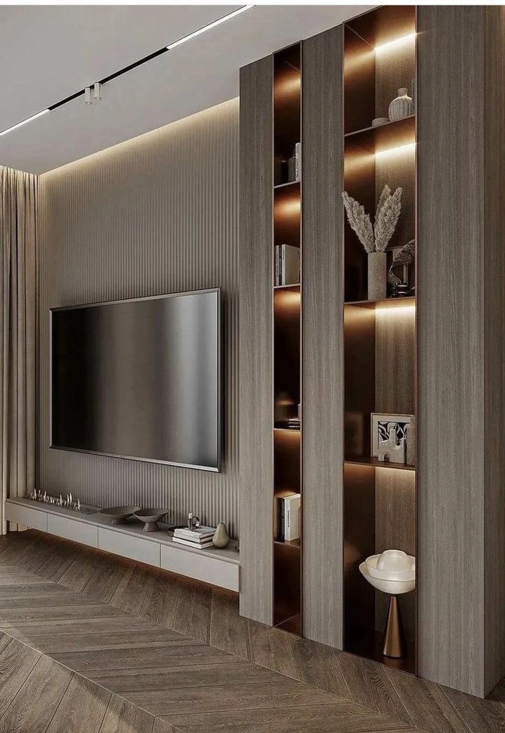 Modern living room with wall-mounted TV and illuminated shelving.