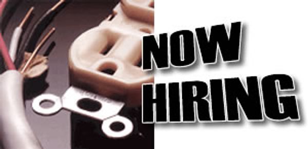 "NOW HIRING" text next to an electrical outlet and exposed wires