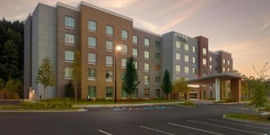 Modern hotel building at sunset.
