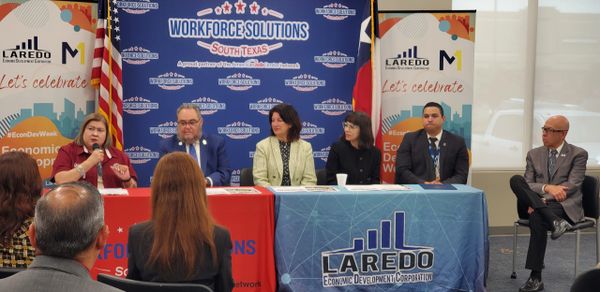 Panel discussion at Laredo Economic Development event with diverse speakers.