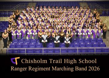 High school marching band group photo in purple and white uniforms.
