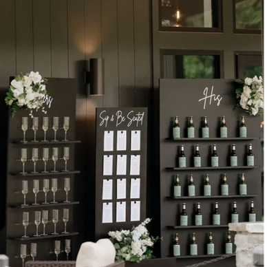 Wedding drink and seating arrangement display with floral decorations.