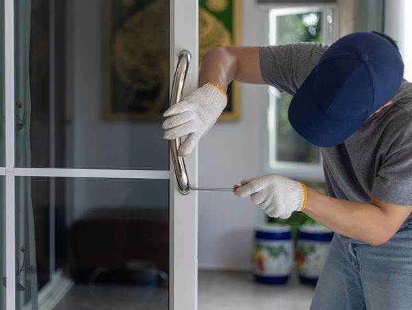 Hand holding freshly cut key.