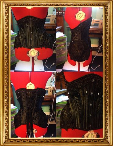 Oh Industry in black satin with lace, bead, and rhinestone accents 