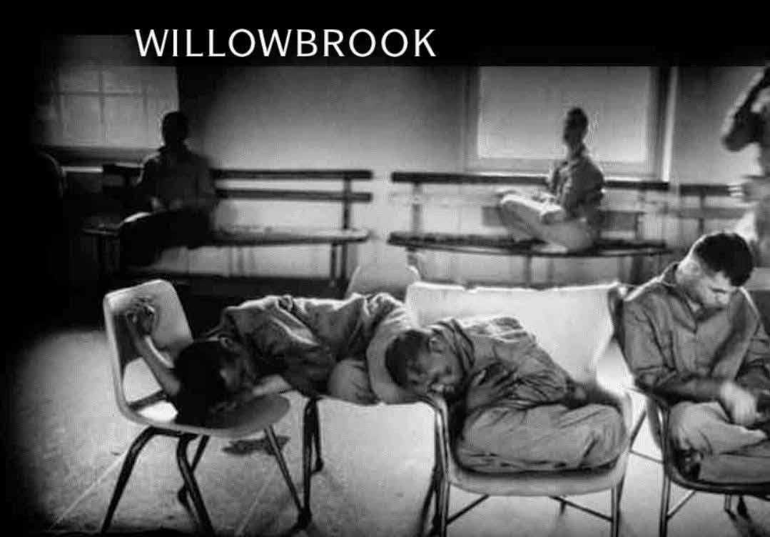 Black-and-white image of people resting in a sparse room labeled 'Willowbrook'.
