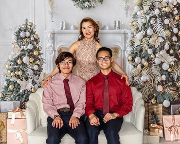 Cozy holiday portraits with decorated Christmas tree